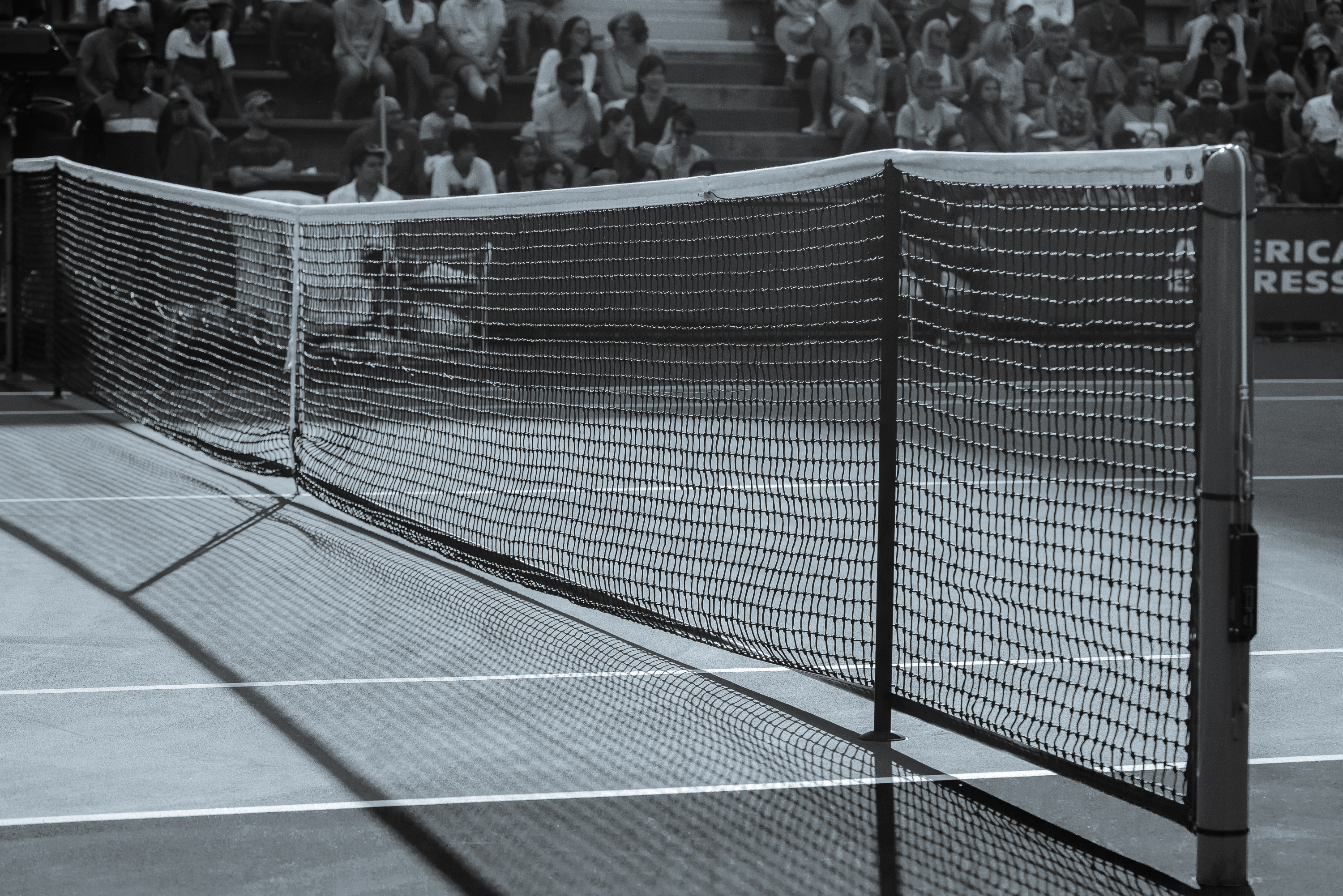 Black-and-white archival photograph of a tennis net and court at the 2015 US Open